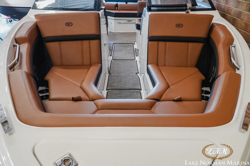 Slide: The Image of 2024 Cobalt R4 boat interior with luxurious brown seating at Lake Norman Marina. - 5