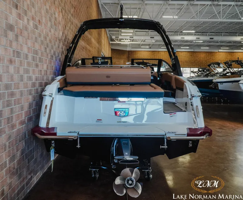 Slide: The Image of 2024 Cobalt R4 boat displayed indoors at Lake Norman Marina. - 6