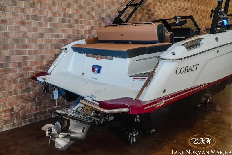 Slide: The Image of 2024 Cobalt R4 boat at Lake Norman Marina, showcasing sleek design and powerful engine. - 7