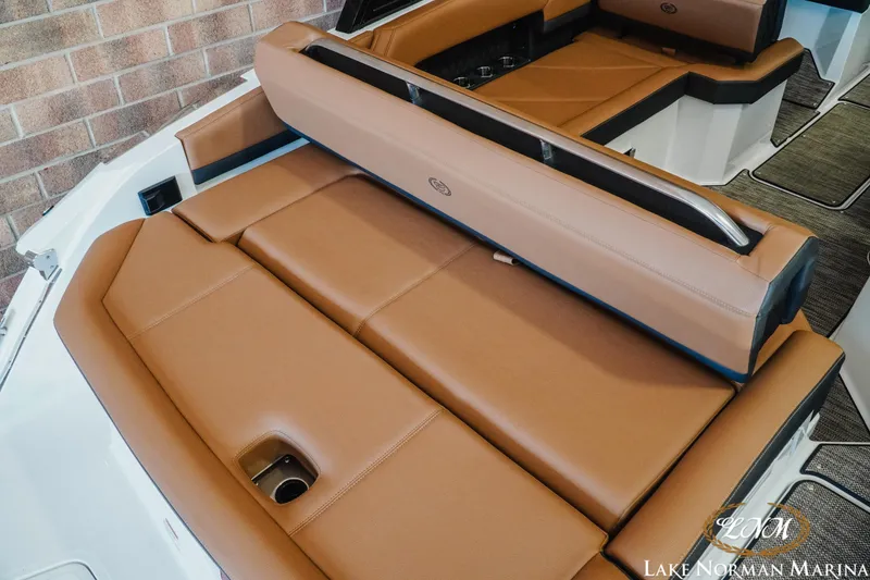 Slide: The Image of 2024 Cobalt R4 boat interior with tan leather seating at Lake Norman Marina. - 9