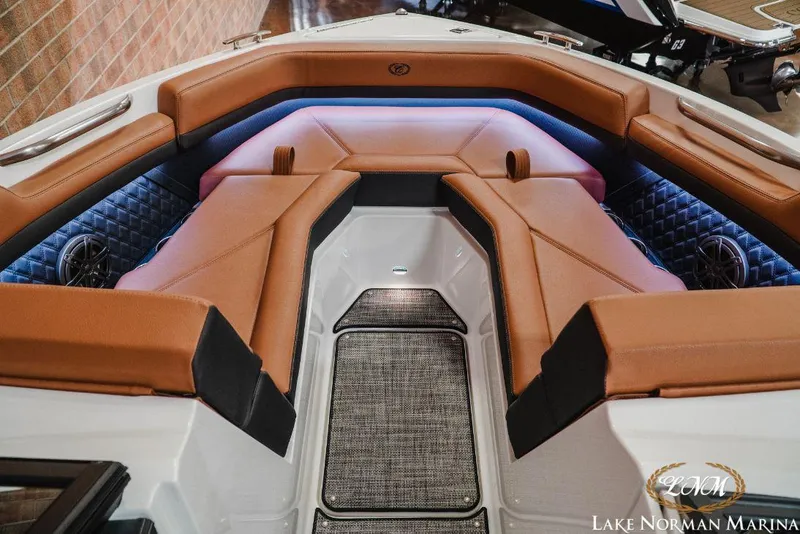 Slide: The Image of Luxurious interior of 2022 Cobalt R4 boat with brown seating and ambient lighting. - 12