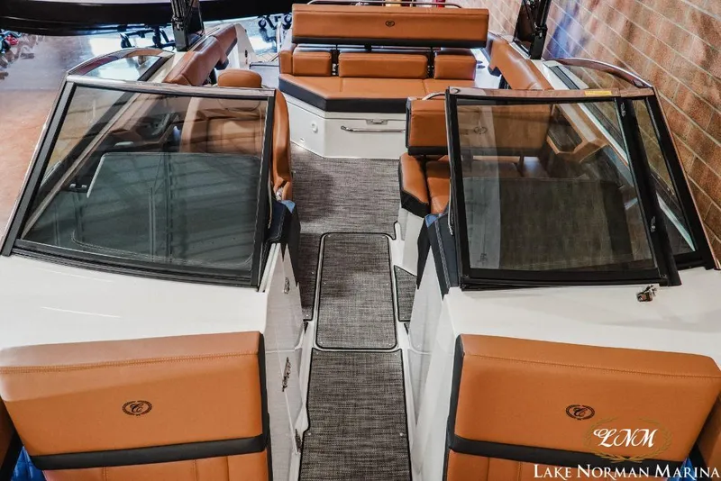 Slide: The Image of 2022 Cobalt R4 boat interior with tan leather seats and sleek design at Lake Norman Marina. - 13