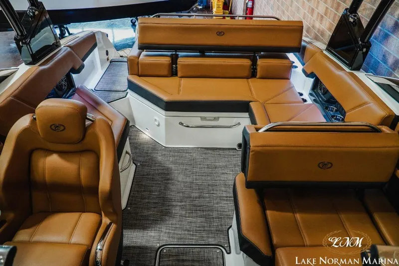 Slide: The Image of Luxurious interior of 2022 Cobalt R4 boat with brown leather seating at Lake Norman Marina. - 14