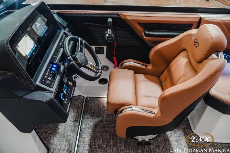 Slide: The Image of Luxurious 2022 Cobalt R4 boat cockpit with leather seat and advanced control panel. - 15