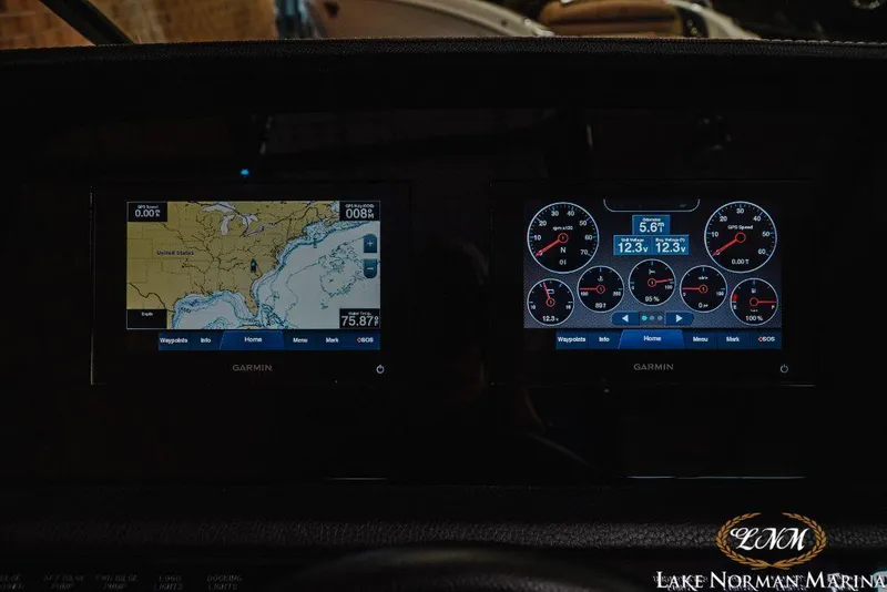 Slide: The Image of Dashboard of a 2022 Cobalt R4 boat with Garmin navigation and instrument displays. - 18