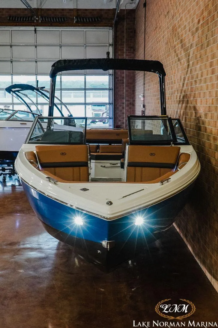 Slide: The Image of 2022 Cobalt R4 boat displayed indoors at Lake Norman Marina. - 4