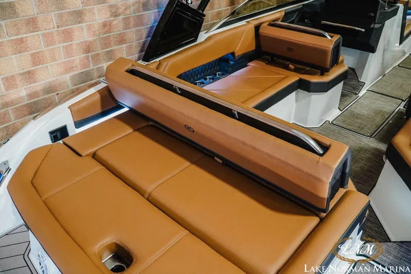 Slide: The Image of 2022 Cobalt R4 boat interior with tan leather seating and modern design. - 7