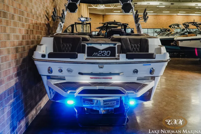 Slide: The Image of 2025 Malibu M230 boat with illuminated transom at Lake Norman Marina. - 9