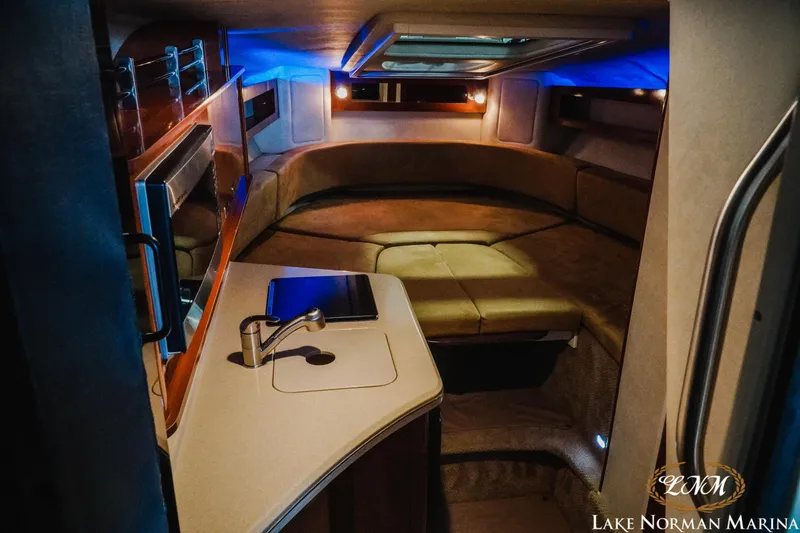 Slide: The Image of Interior of 2011 Sea Ray 280 Sundancer yacht with cozy seating and ambient lighting. - 14