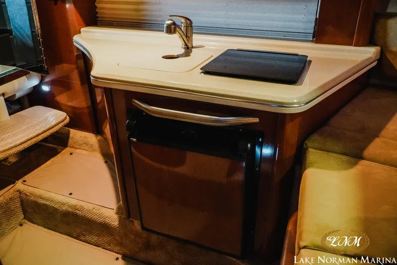 Slide: The Image of Interior of 2011 Sea Ray 280 Sundancer with kitchenette and sink. - 17