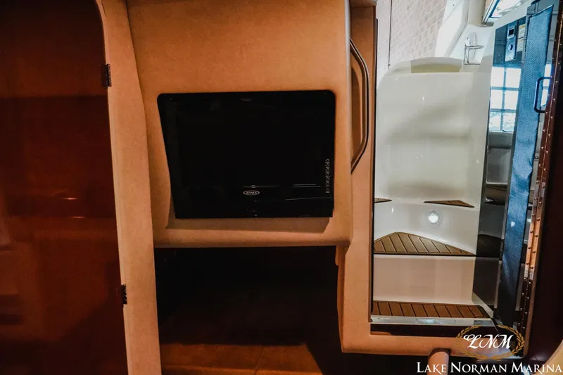 Slide: The Image of Interior of 2011 Sea Ray 280 Sundancer with TV and cabin view. - 18