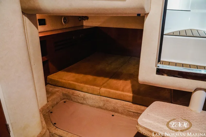 Slide: The Image of Interior cabin of 2011 Sea Ray 280 Sundancer with cozy seating and carpeted flooring. - 20