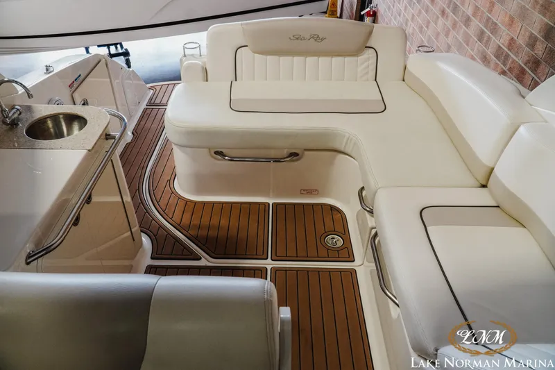 Slide: The Image of Interior of 2011 Sea Ray 280 Sundancer with elegant seating and teak flooring. - 22