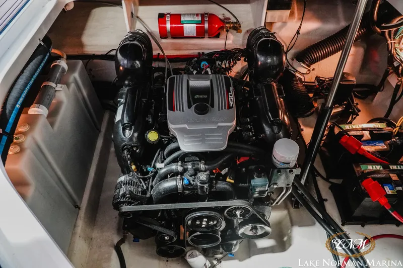 Slide: The Image of Engine compartment of a 2011 Sea Ray 280 Sundancer with visible fire extinguisher and batteries. - 24