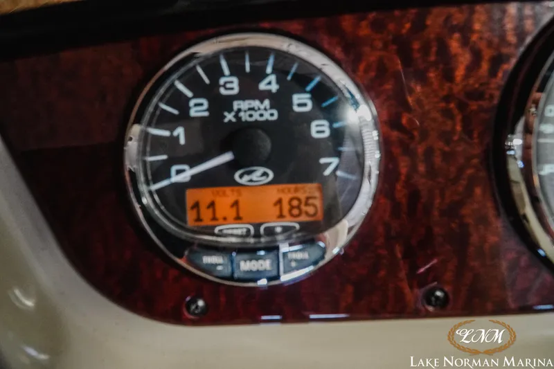 Slide: The Image of Tachometer of 2011 Sea Ray 280 Sundancer showing RPM and voltage readings. - 25