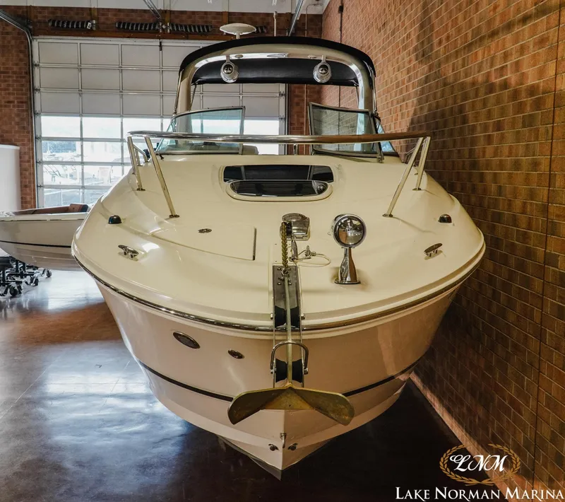 Slide: The Image of 2011 Sea Ray 280 Sundancer boat displayed indoors at Lake Norman Marina. - 5