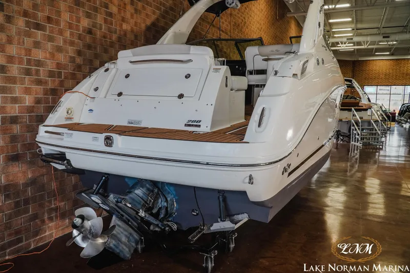Slide: The Image of 2011 Sea Ray 280 Sundancer boat displayed indoors at Lake Norman Marina. - 6