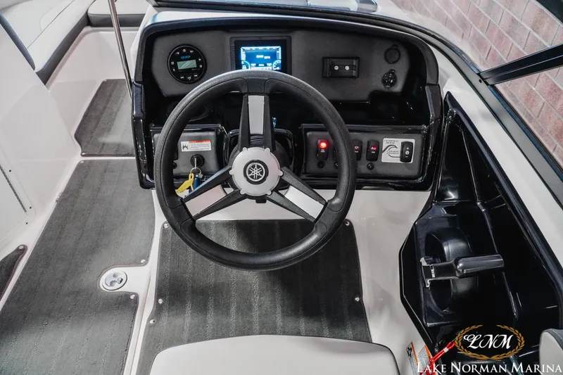 Slide: The Image of 2022 Yamaha Boats AR 190 dashboard with steering wheel and control panel. - 10