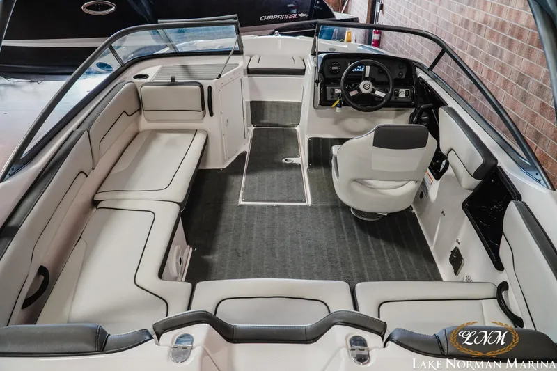 Slide: The Image of 2022 Yamaha Boats AR 190 interior with seating and steering wheel at Lake Norman Marina. - 7
