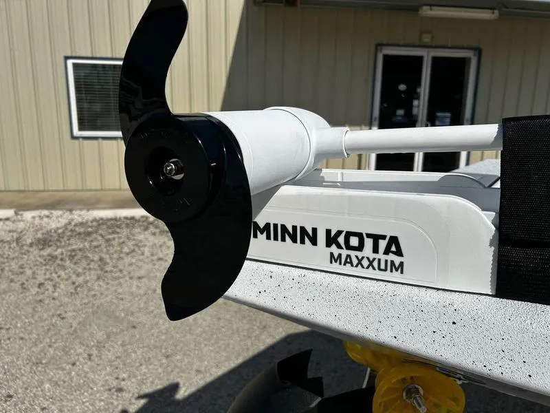 Slide: The Image of Minn Kota Maxxum motor on 2025 Xpress H22B boat, outdoor setting. - 13