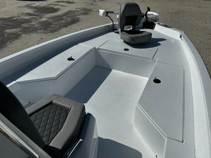 Slide: The Image of 2025 Xpress H22B boat interior with seating and storage compartments. - 5