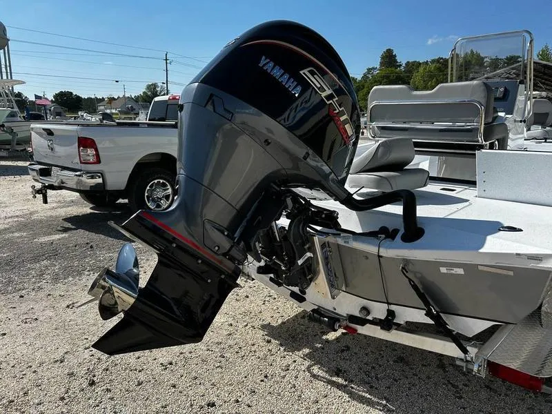 Slide: The Image of 2025 Xpress H22B boat with Yamaha outboard motor in a sunny outdoor setting. - 9