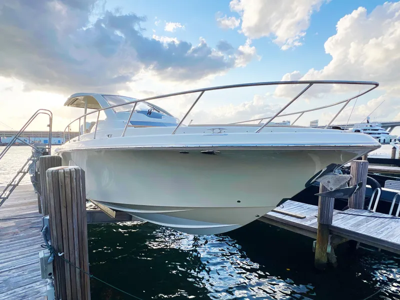 The Image of 2018 Chris-Craft Launch boat docked at marina under a partly cloudy sky. - 0