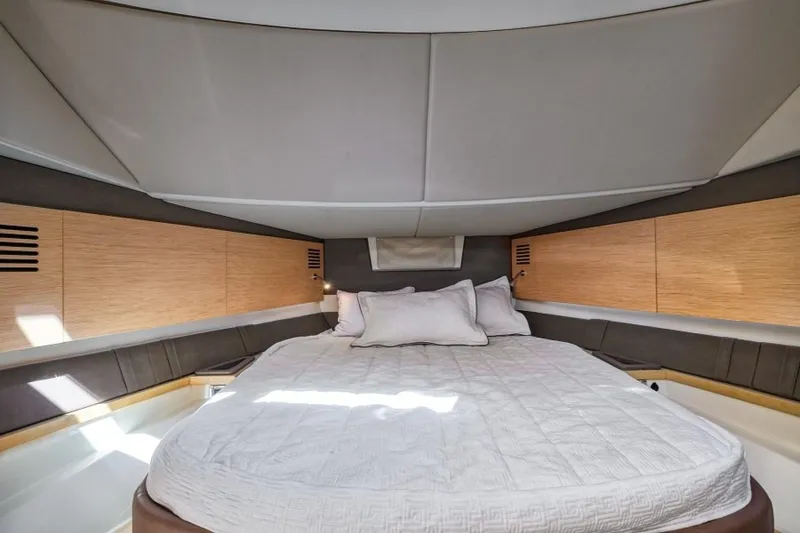 Slide: The Image of Luxurious cabin interior of 2018 Chris-Craft Launch boat with cozy bedding. - 10