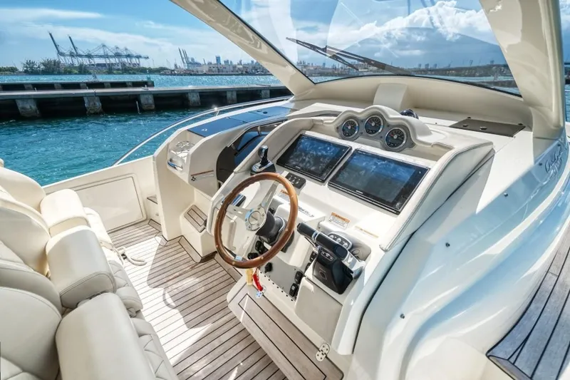 Slide: The Image of 2018 Chris-Craft Launch boat cockpit with luxurious seating and modern navigation controls. - 2