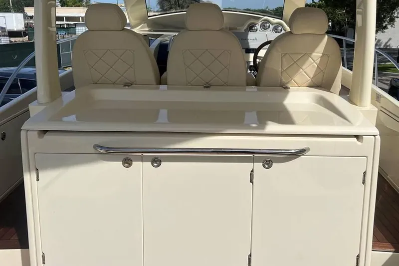Slide: The Image of 2018 Chris-Craft Launch boat interior with beige seating and dashboard. - 4