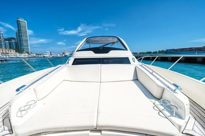 Slide: The Image of 2018 Chris-Craft Launch yacht with spacious deck, docked in a sunny marina. - 7