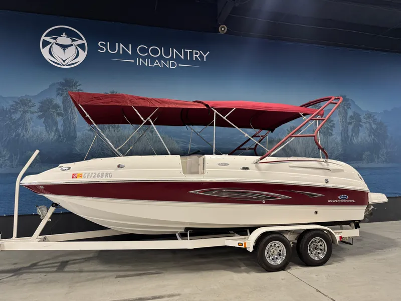 Slide: The Image of 2005 Chaparral Sunesta 232 boat with red canopy on a trailer at Sun Country Inland. - 1