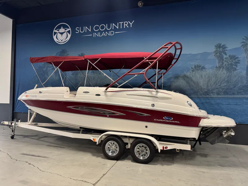 Slide: The Image of 2005 Chaparral Sunesta 232 boat with red canopy on trailer at Sun Country Inland showroom. - 3