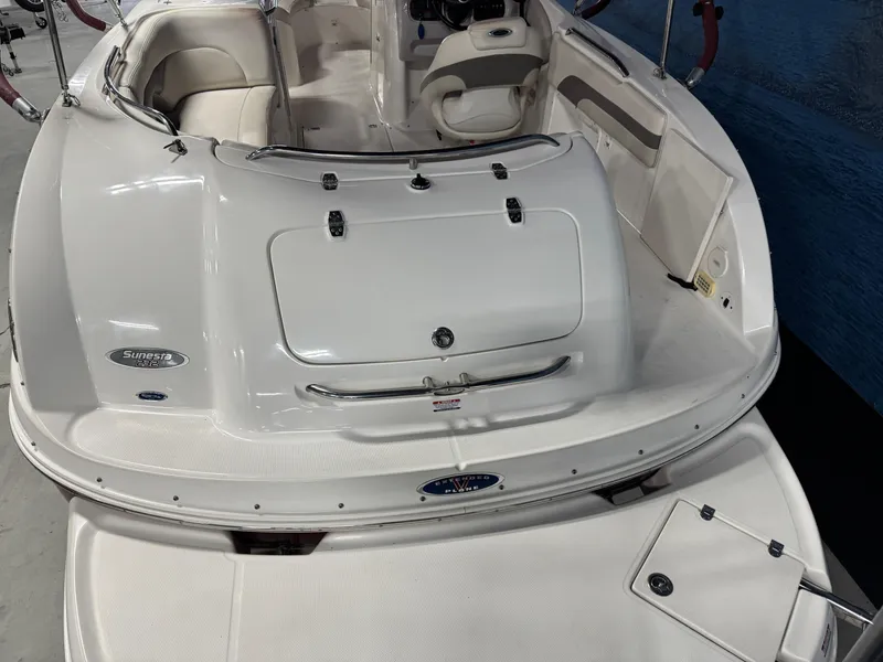 Slide: The Image of 2005 Chaparral Sunesta 232 boat, white interior, spacious seating, rear view. - 5