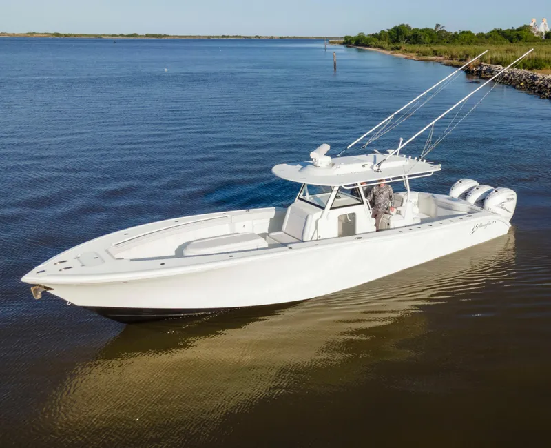 The Image of 2019 Yellowfin 39 Offshore boat on calm water, featuring sleek design and powerful engines. - 1