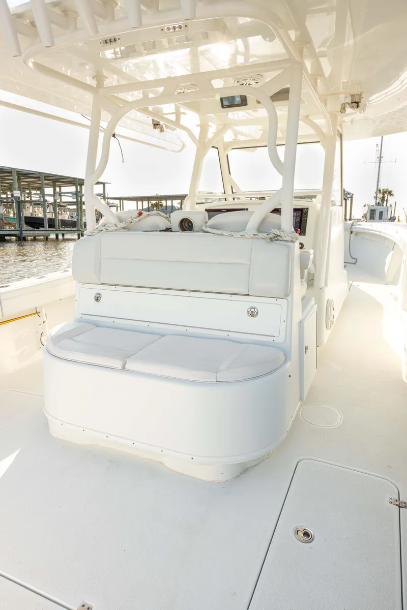 Slide: The Image of 2019 Yellowfin 39 Offshore boat interior with white seating and sleek design. - 13
