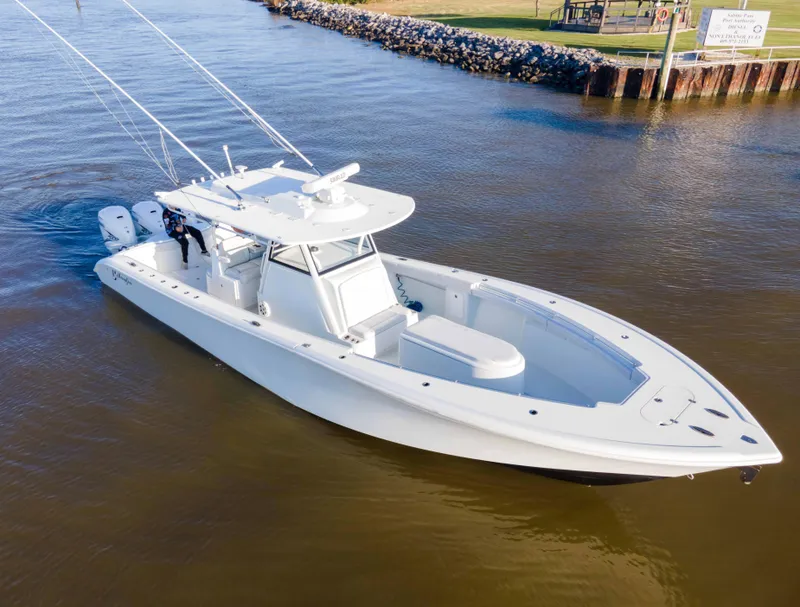 Slide: The Image of 2019 Yellowfin 39 Offshore boat cruising on calm waters. - 2