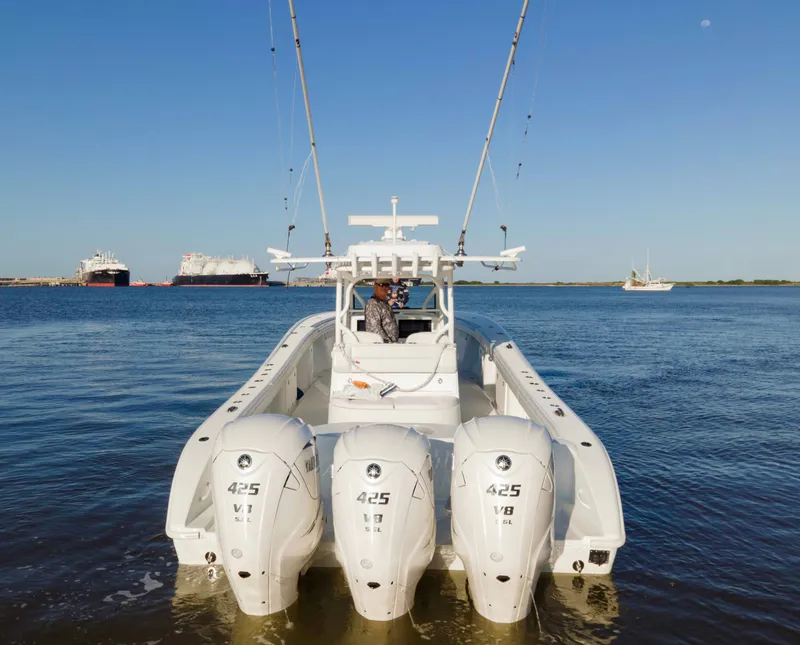 Slide: The Image of 2019 Yellowfin 39 Offshore boat with triple 425 V8 engines on calm water. - 5