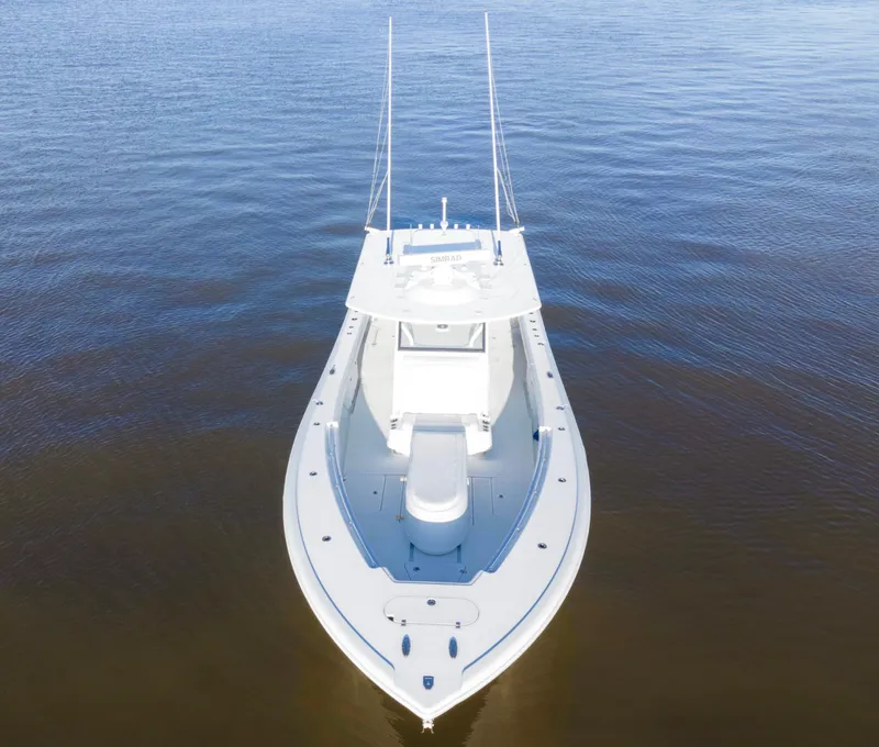 Slide: The Image of 2019 Yellowfin 39 Offshore boat on calm water, aerial view. - 7