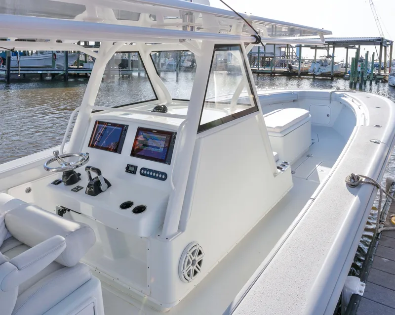 Slide: The Image of 2019 Yellowfin 39 Offshore boat with modern helm, docked at marina. - 9