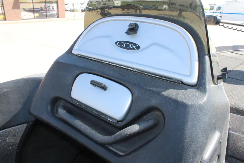 Slide: The Image of 2005 Nitro 901 CDX boat dashboard with storage compartments and CDX logo. - 14