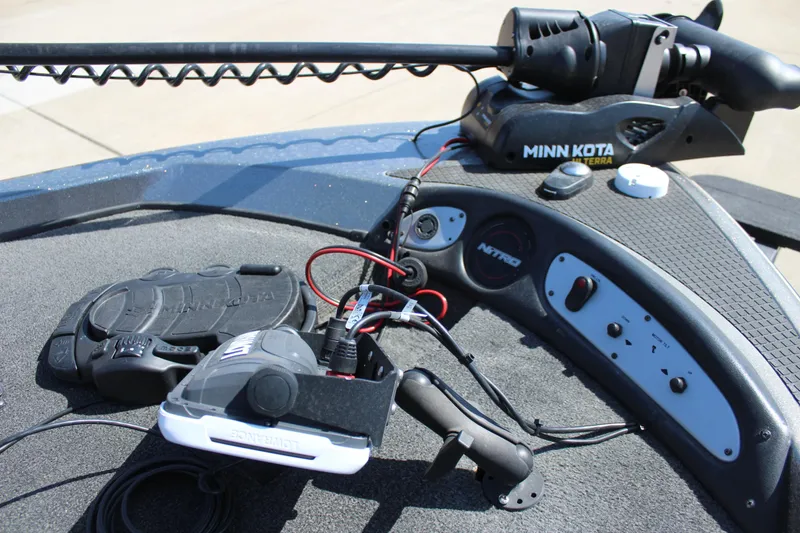 Slide: The Image of 2005 Nitro 901 CDX boat dashboard with Minn Kota trolling motor and control panel. - 18