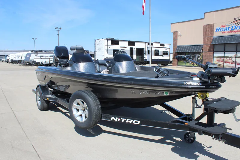 Slide: The Image of 2005 Nitro 901 CDX boat on trailer in dealership lot. - 2