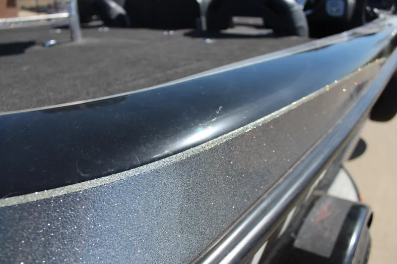 Slide: The Image of Close-up of a 2005 Nitro 901 CDX boat's sleek metallic surface. - 28
