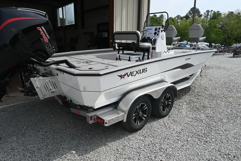 Slide: The Image of 2025 Vexus ACX2210 boat on trailer, parked outdoors near a building. - 10
