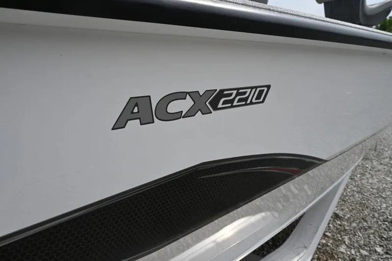 Slide: The Image of 2025 Vexus ACX2210 boat model logo on white hull. - 11