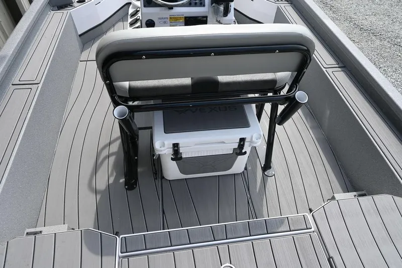 Slide: The Image of 2025 Vexus ACX2210 boat interior with seating and storage. - 8
