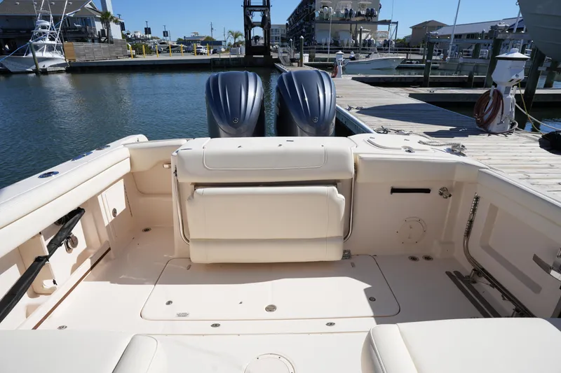 Slide: The Image of 2022 Grady-White Freedom 285 boat interior at a marina dock. - 14
