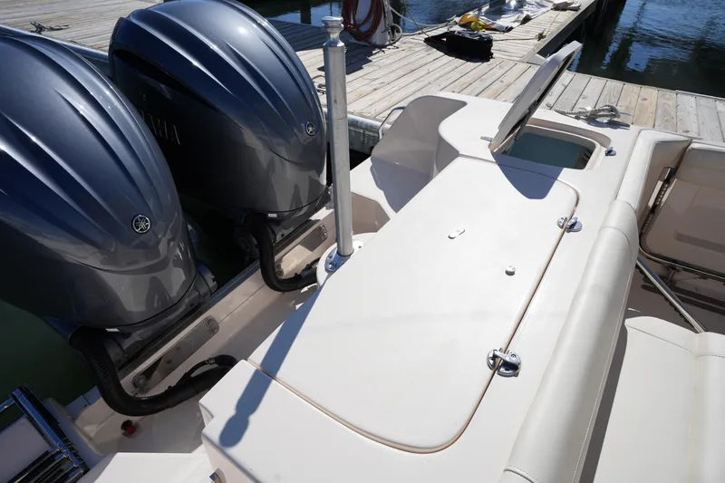 Slide: The Image of 2022 Grady-White Freedom 285 boat with dual engines at dock. - 16