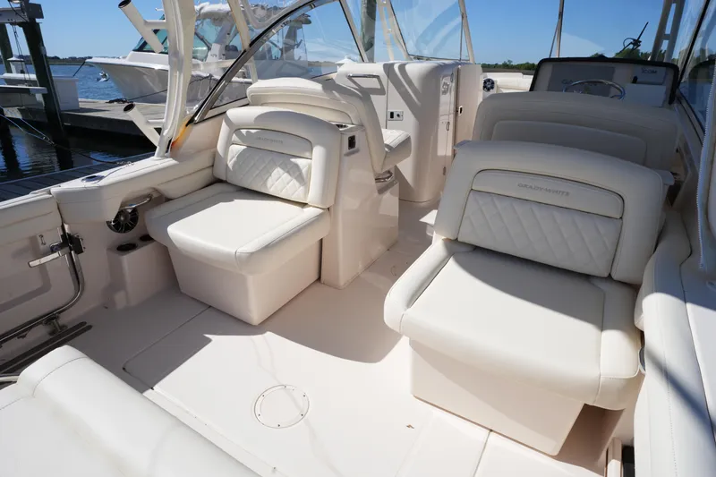 Slide: The Image of 2022 Grady-White Freedom 285 boat interior with luxurious white seating. - 17